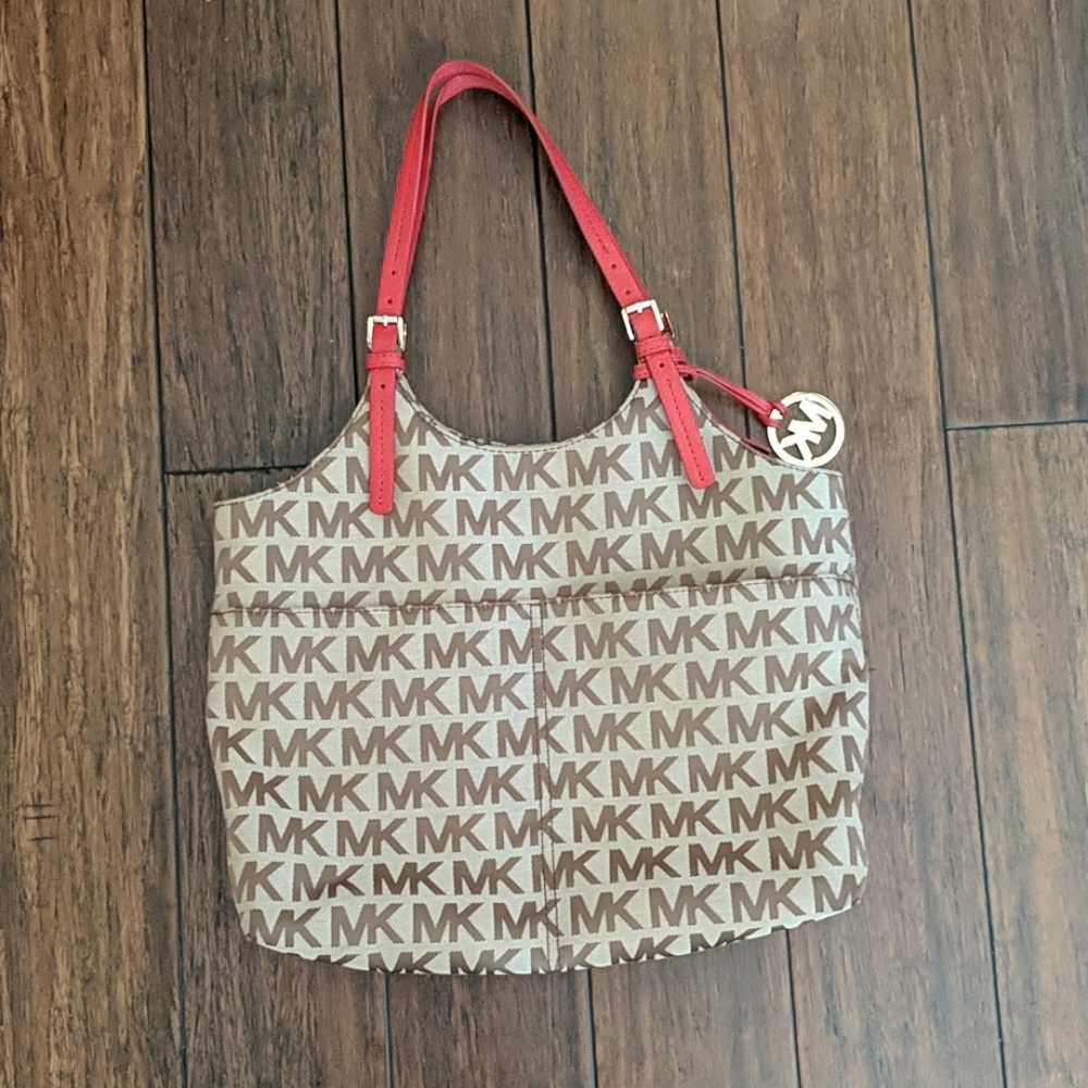 Michael Kors purse. Brown with red leather.